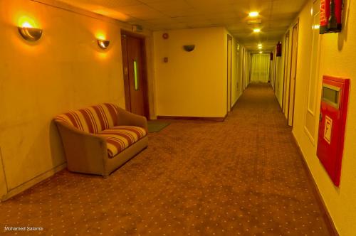 a hallway with a couch in the middle of a room at Resta Port Said Hotel in Port Said