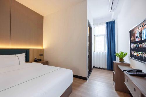 Televisyen dan/atau pusat hiburan di Yue Sheng Hotel Guangzhou Railway St ation广州火车站