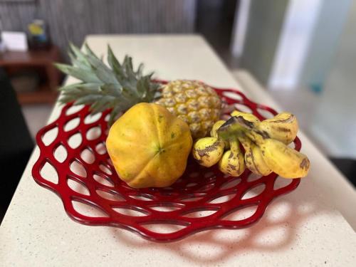 a basket of fruit sitting on a table at Libby's Vacation Rental 2 Bed Home 1-4 Guests in Nadi