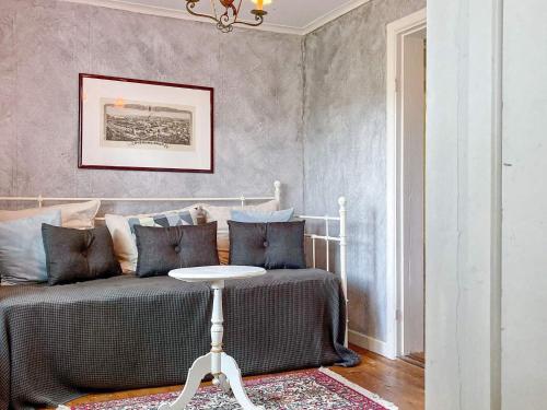 a bedroom with a bed with a table next to it at 6 person holiday home in ÖVERUM-By Traum in Överum