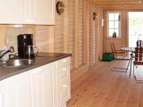 a kitchen with a sink and a counter top at 6 person holiday home in HÄLLEVIKSSTRAND-By Traum in Hälleviksstrand