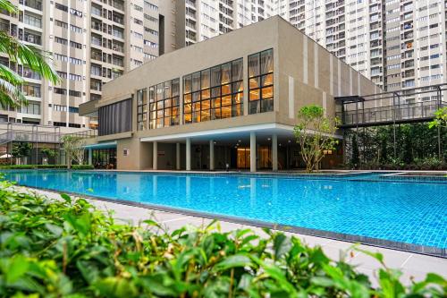 a large building with a large swimming pool at Youth City in Nilai
