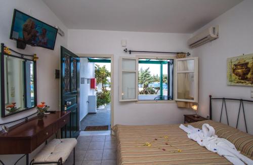 a bedroom with two beds in a room at Akrothalassia in Adamantas