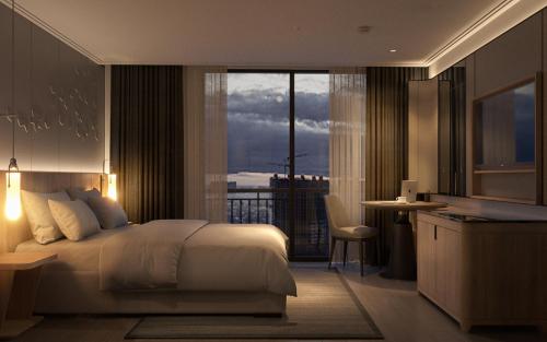 a hotel room with a bed and a balcony at HOTEL du LAC SIGNATURE in Hanoi