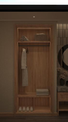 a bathroom with a wooden cabinet with a towel on it at HOTEL du LAC SIGNATURE in Hanoi