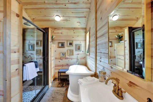 a bathroom with a sink and a mirror at 3 Acres of Luxury and Views in Fred Wine Country! in Luckenbach