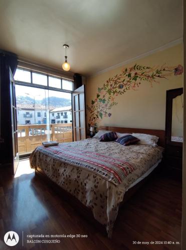 Ένα ή περισσότερα κρεβάτια σε δωμάτιο στο Hospedaje Balcón Cusqueño