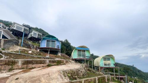 a group of cottages on top of a hill at Memory เมมโมรี่ ภูทับเบิก in Ban Maeo Thap Boek
