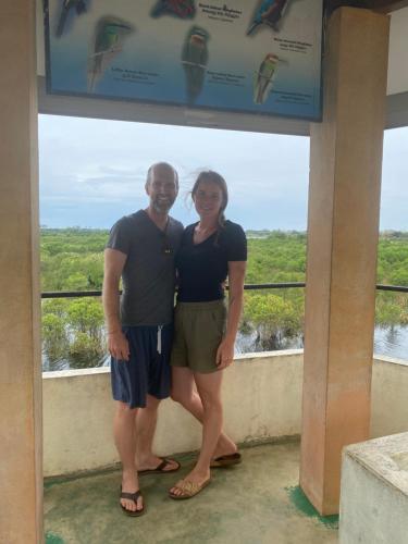 a man and a woman standing on a balcony at Secret Paradise Panama in Panama