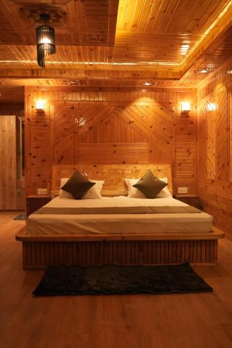 Ένα ή περισσότερα κρεβάτια σε δωμάτιο στο Mukund Cottage