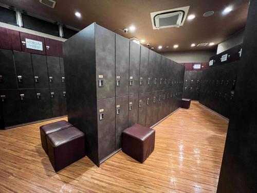 a locker room with a bunch of lockers at Anshin Oyado Akihabara Denkigaiten in Tokyo