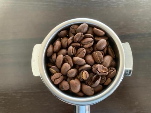 a cup full of coffee beans on a table at 29 Eleven bed and breakfast in Bungmati