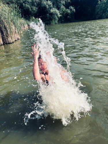 a man is in the water in the water at Faina Garna Hata in Medvin