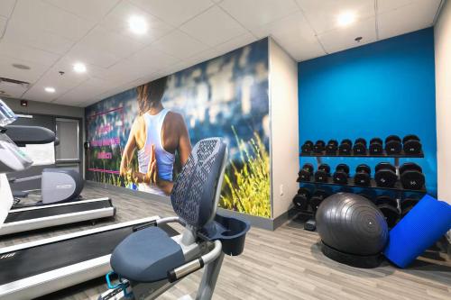 a gym with a wall with a picture of a player at Wingate Augusta Washington Road by Wyndham in Augusta