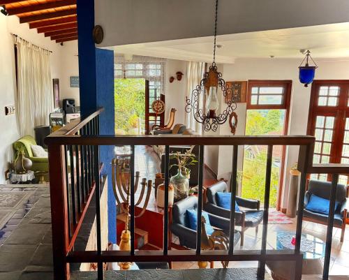 a living room with a table and chairs at Bethel Rest Homestay in Kandy