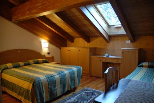 Postel nebo postele na pokoji v ubytování Hotel Sport