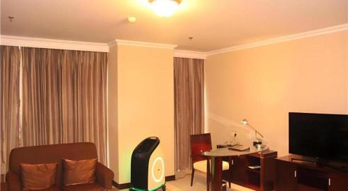 TV a/nebo společenská místnost v ubytování Beijing Jinjiang Fuyuan Hotel