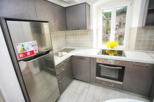 Kuchyň nebo kuchyňský kout v ubytování Apartments Barizon