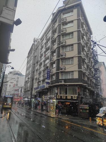 a building on a city street in the rain at Mara Oldcity Hotel in Istanbul