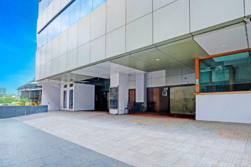 a large white building with a lot of windows at Townhouse Variety Square Near NIT Plaza in Nagpur