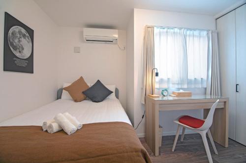 Ένα ή περισσότερα κρεβάτια σε δωμάτιο στο Osaka - House - Vacation STAY 16270