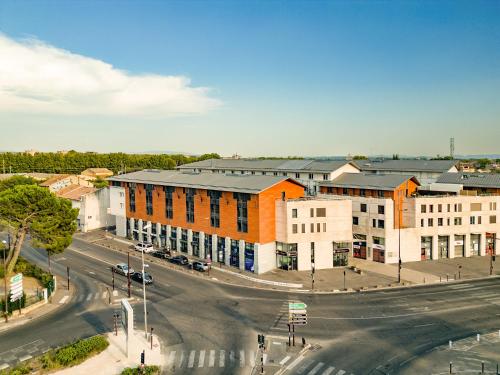 an aerial view of a street with buildings at ApartHotel Sainte-Marthe in Avignon