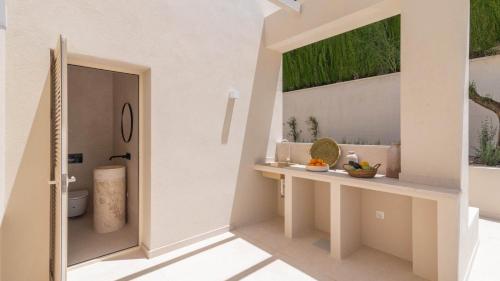 a bathroom with a toilet and a window at Villa Selena Antequera by Ruralidays in Antequera
