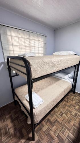 a bedroom with two bunk beds in a room at Peace N' Green in David