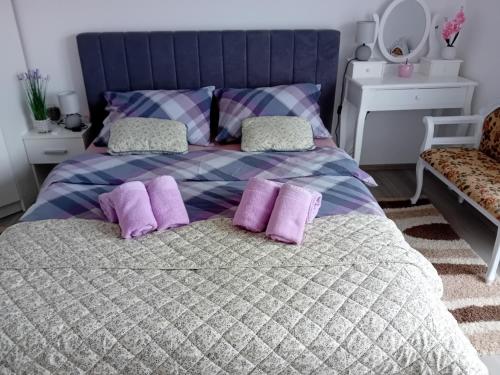 Postel nebo postele na pokoji v ubytování Apartmani Ani