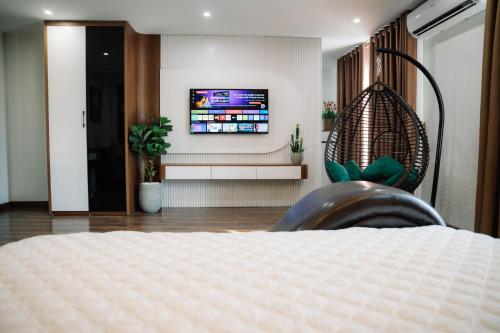 TV a/nebo společenská místnost v ubytování Minh Grand Ha Noi Hotel