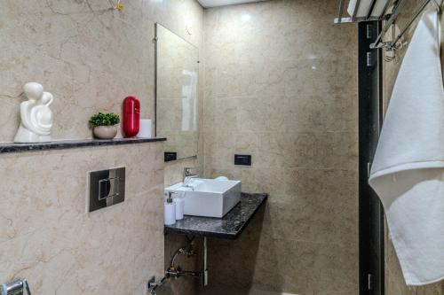 a bathroom with a sink and a shower at One Stayz by Zipcode in Gurgaon