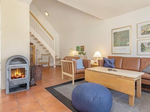 a living room with a couch and a fireplace at Luxury Retreat in Blavand - By Traum Ferienwohnungen in Blåvand