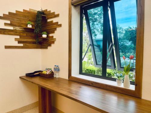 a window in a room with a wooden window sill at Hoa Lu Garden Resort in Ninh Binh