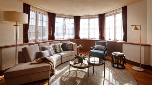a living room with a couch and a chair at Lotte Arai Resort in Myoko