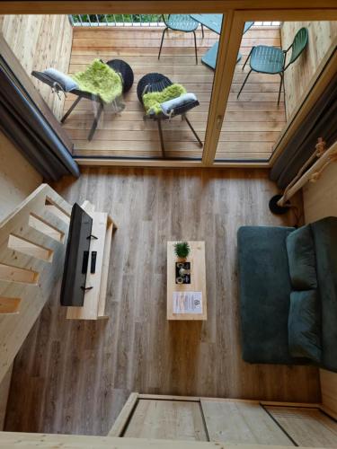 an overhead view of a living room with chairs and a tv at Berger's Bergsicht by edita in Scheidegg