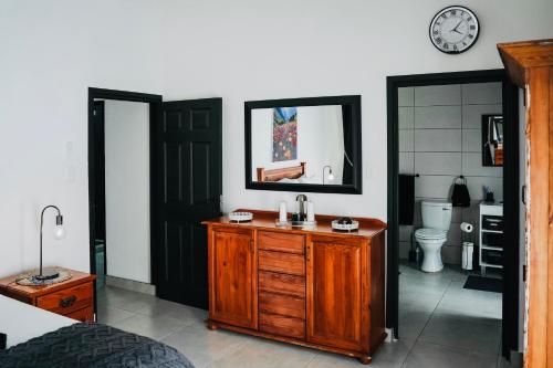 a bathroom with a sink and a mirror at Calabash Cape Town in Darling