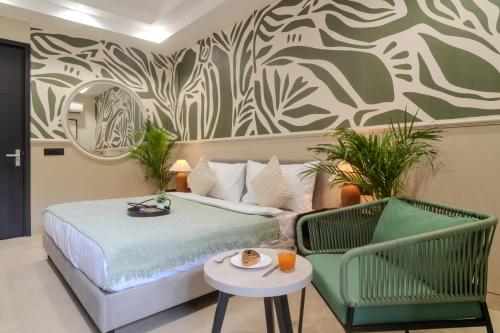 a bedroom with a bed and a table and chairs at One Stayz by Zipcode in Gurgaon