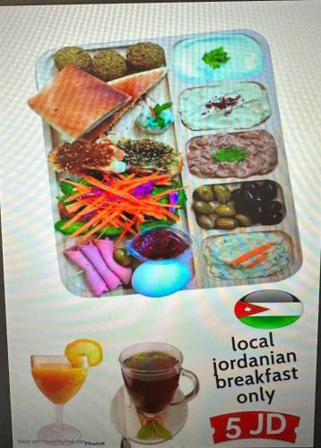 a poster of a lunch box with different types of food at Happy Beach For Studio Rooms Apartment شاطئ السعادة للشقق المفروشة in Aqaba