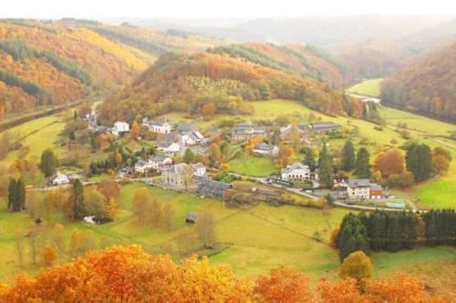 a small town in the middle of a hill at luxe vakantiewoning met jacuzzi en sauna Forêt d'Animaux in Bouillon