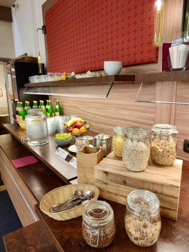 a kitchen counter with jars of food on a table at Stadthotel Raabs an der Thaya in Raabs an der Thaya