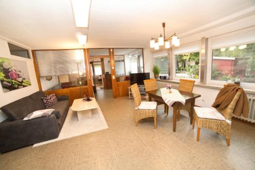 a living room with a couch and a table at Ferienwohnung Naturpur in Rheinau