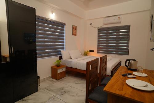 Ένα ή περισσότερα κρεβάτια σε δωμάτιο στο Green Pearl Residency
