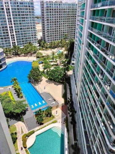 an aerial view of a resort with a pool and buildings at Havenscape Staycation in Manila