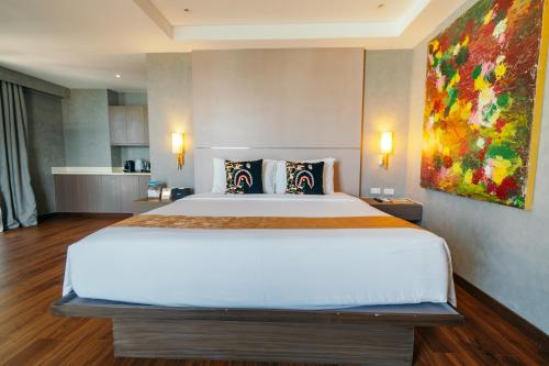 Una cama o camas en una habitación de S Resort El Nido Managed by H Hospitality Group