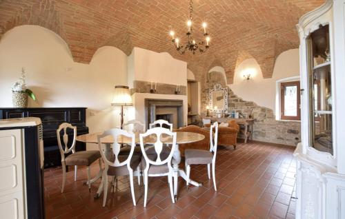 a dining room with a table and chairs at Lovely Apartment In Civitella Benazzone in Civitella Benazzone
