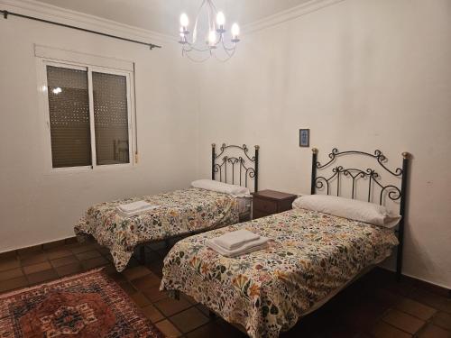 Postel nebo postele na pokoji v ubytování Casa Rural Los Chorros de Joyarancón