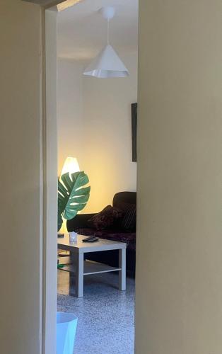 a living room with a couch and a table at Madaba Hills Apt in Madaba