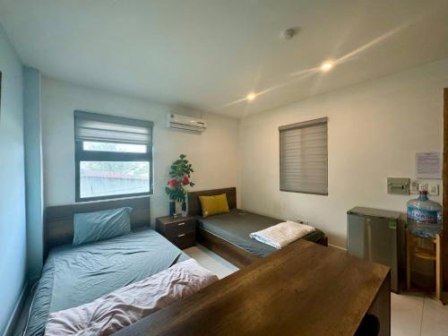 Ein Bett oder Betten in einem Zimmer der Unterkunft Triệu Nguyễn Hotel