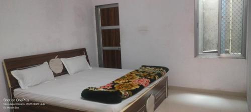 Katil atau katil-katil dalam bilik di Sanwariya Guest House