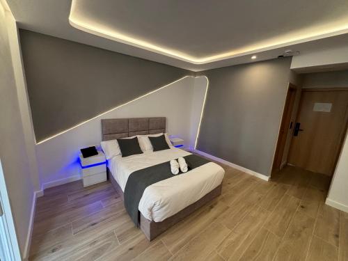 a bedroom with a large bed in a room at Futurotel Granada Dreams in Granada